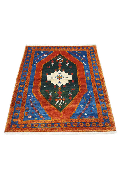 Gabbeh rug: central diamond with decorative arch, blue ornamental band, and orange border