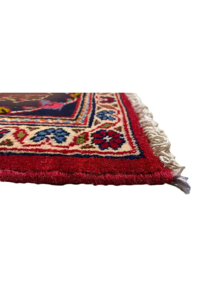 Carpet corner with fringed edge and red border, blue-and-white trim
