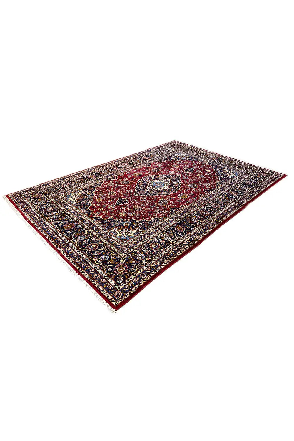 Oriental rug with a red central pattern and dark blue-and-gold border, photographed at an angle