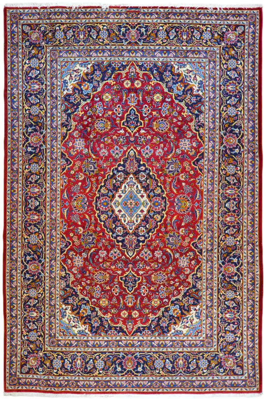 Oriental rug with a red background, blue-and-gold ornaments, and a central medallion