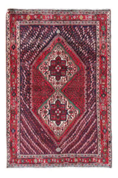 Small Oriental rug with a red diamond medallion, blue background, and ornamental border.