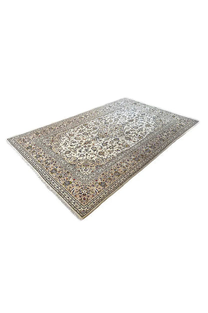 Oriental rug corner with a beige-brown background, ornamental border, and decorative trim