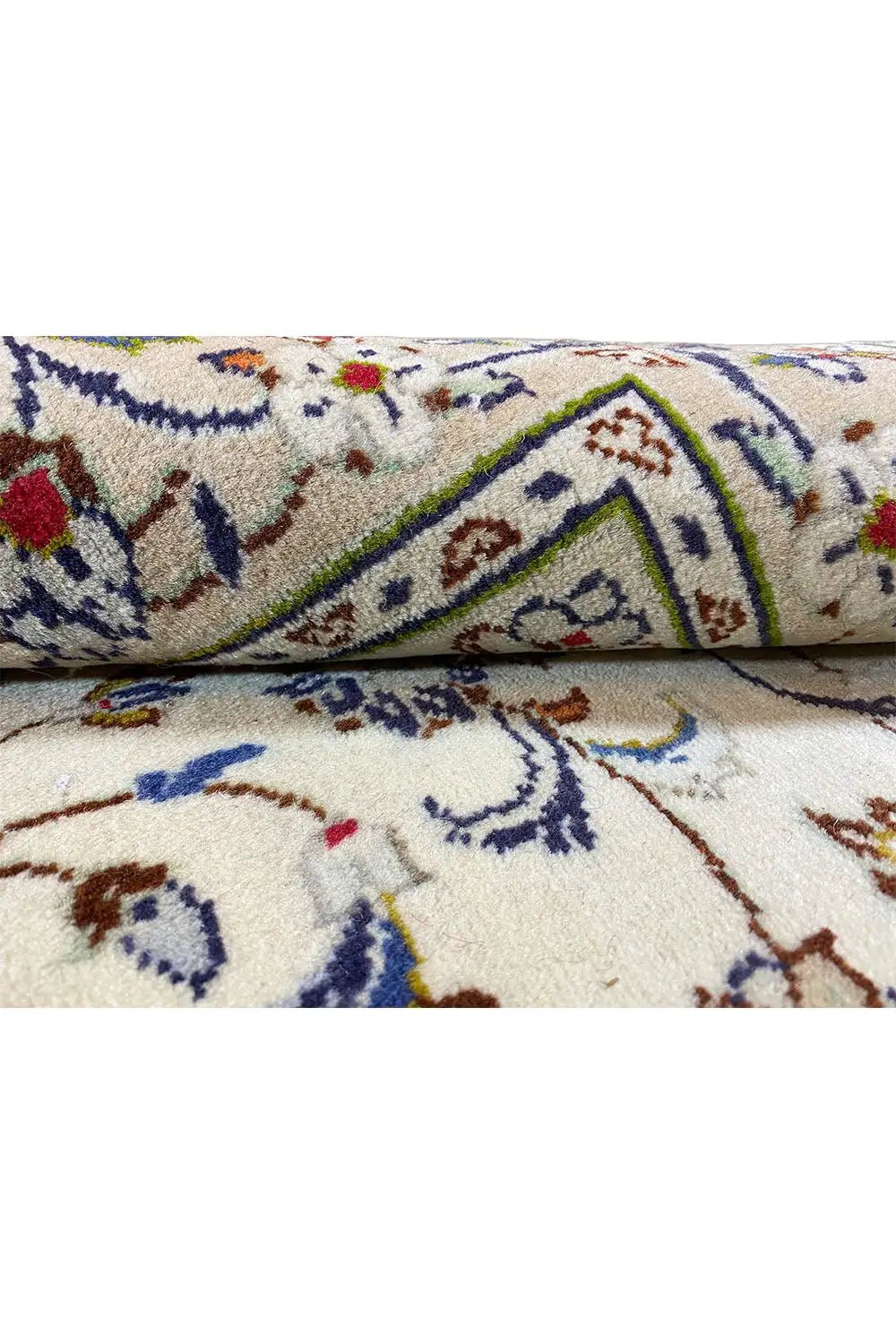 Detail of the Oriental rug with colorful ornaments and beige pile, close-up