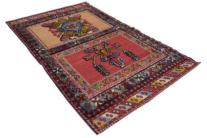 Oriental rug with a red ground and central medallions, multicolored border, approx. 135x83 cm