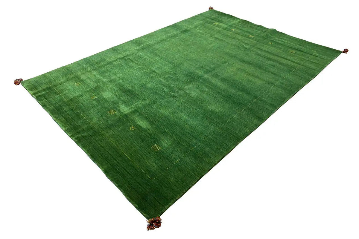 Green Gabbeh rug with a pattern and tassels at the corners, approx. 298×203 cm