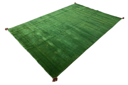 Green Gabbeh rug with a pattern and tassels at the corners, approx. 298×203 cm