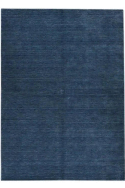 Dark blue carpet, straight-on view, subtle mottled weave pattern
