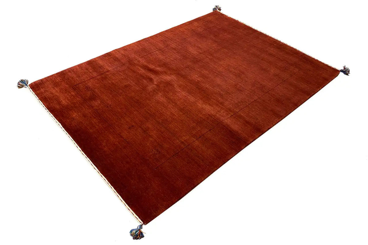 Gabbeh rug, reddish-brown, rectangular, with knots at the corners