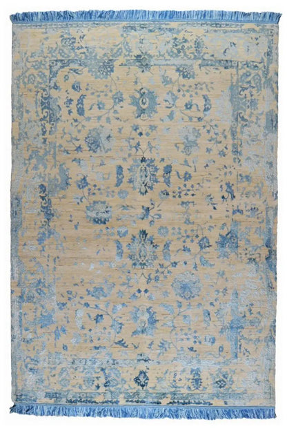 Rectangular designer rug with a blue vintage pattern and fringes