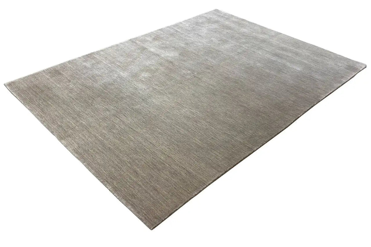 Light gray rectangular rug with a fine, even weave structure