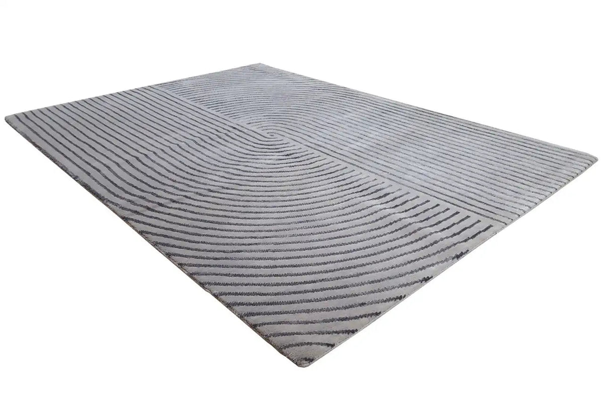 Triangle-shaped rug with a gray background and dark blue wavy lines