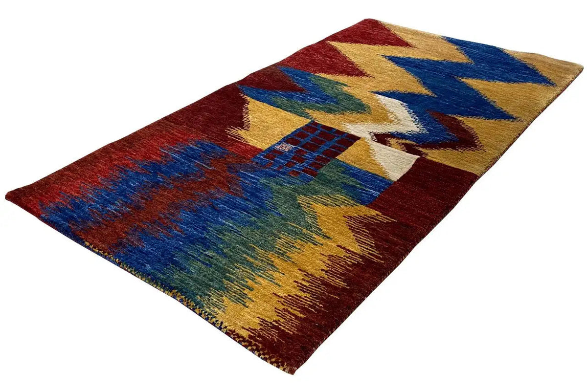 Gabbeh rug with a zigzag pattern in red, blue, yellow and green