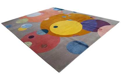 Rug with large colorful circles and dots on a gray background