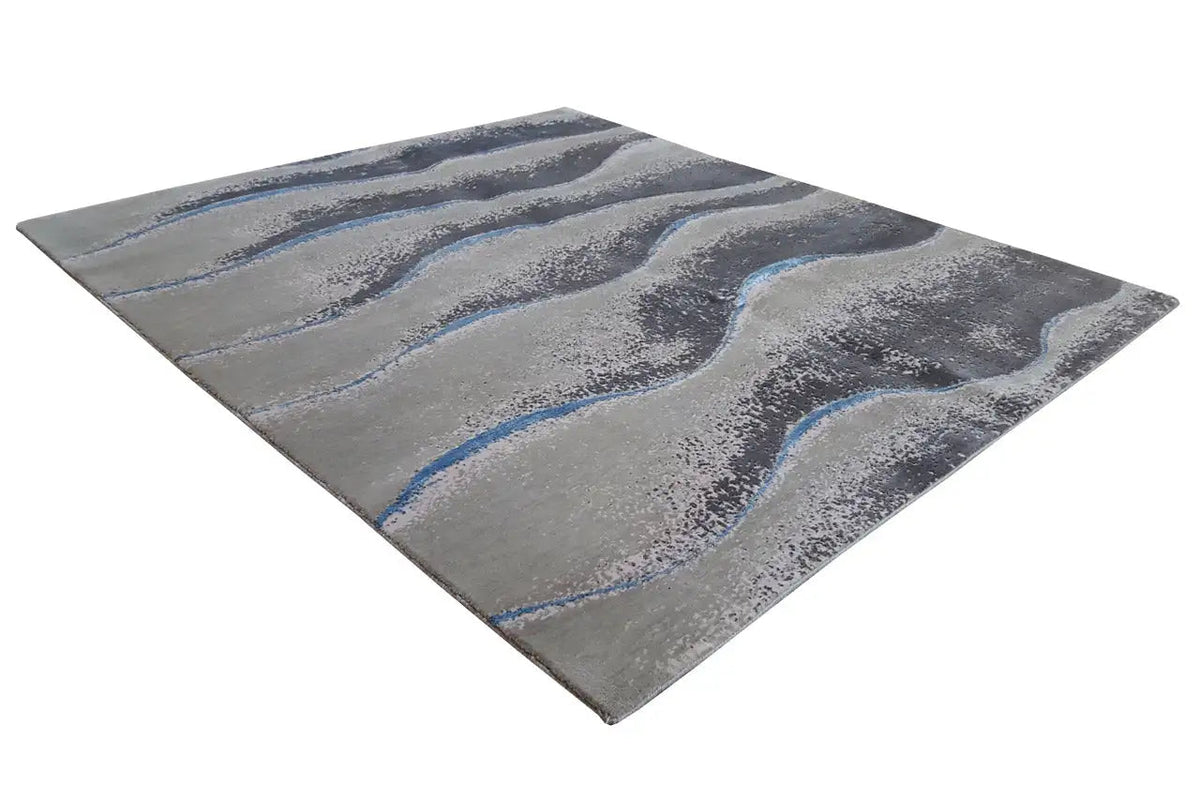 Beach rug 154x183 cm with an abstract wave pattern in gray and blue.