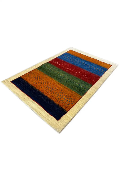 Gabbeh rug 127x80 cm, lying at an angle, stripes with small colored dots and a beige border