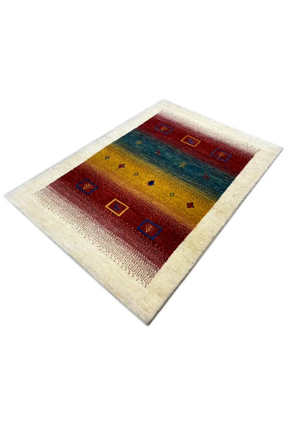 Gabbeh rug 121x83 cm, diagonal view: red tones, blue tones, and yellow area with motifs