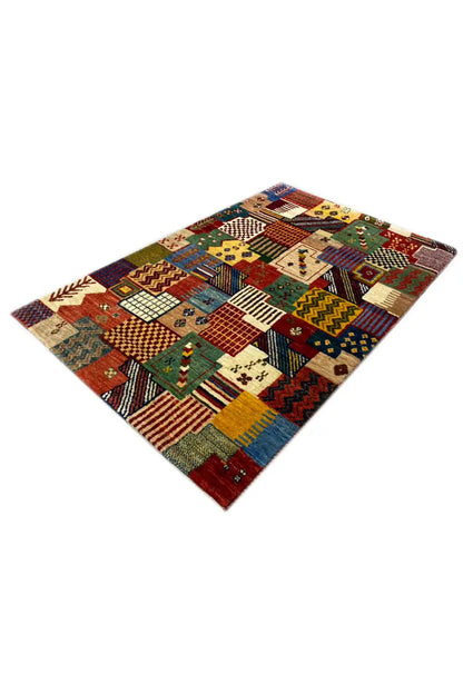 Gabbeh rug 129x80 cm, angled view with colorful patchwork blocks and pattern details