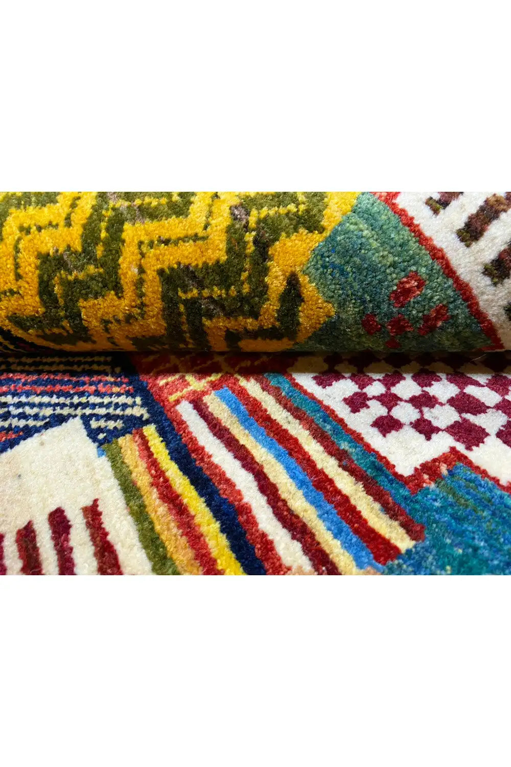 Gabbeh rug 129x80 cm close-up: pile and edge with colorful patterned stripes