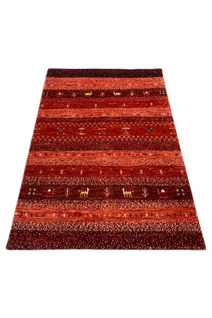 Gabbeh rug, reddish-brown, laid diagonally, with broad stripes and ornaments