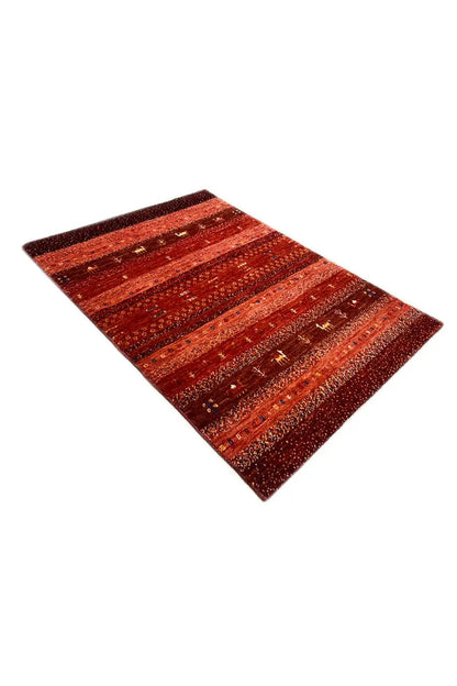 Gabbeh rug, reddish-brown, viewed obliquely from the side, with ornamental stripes