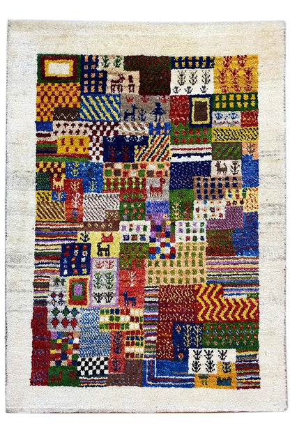 Gabbeh rug front view: patchwork squares with borders and zigzag elements