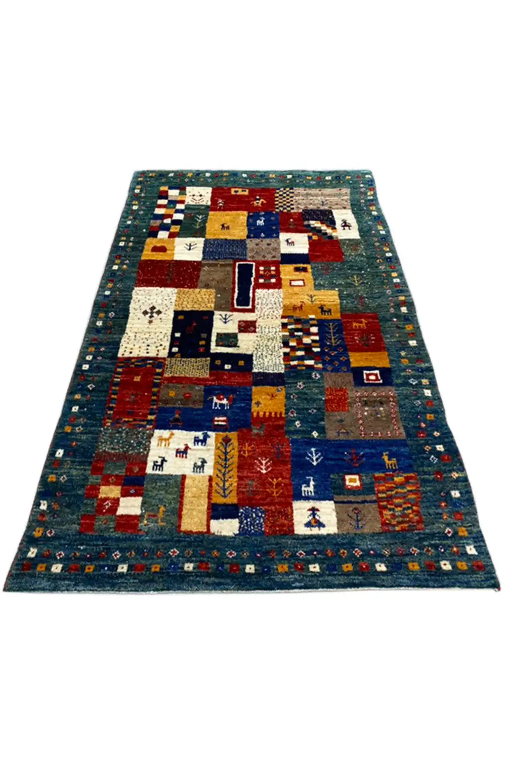 Gabbeh rug (127x79 cm) in blue with geometric patchwork and various motifs
