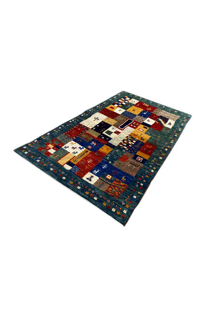 Gabbeh rug (127x79 cm) with patchwork design in blue, red, white, and yellow