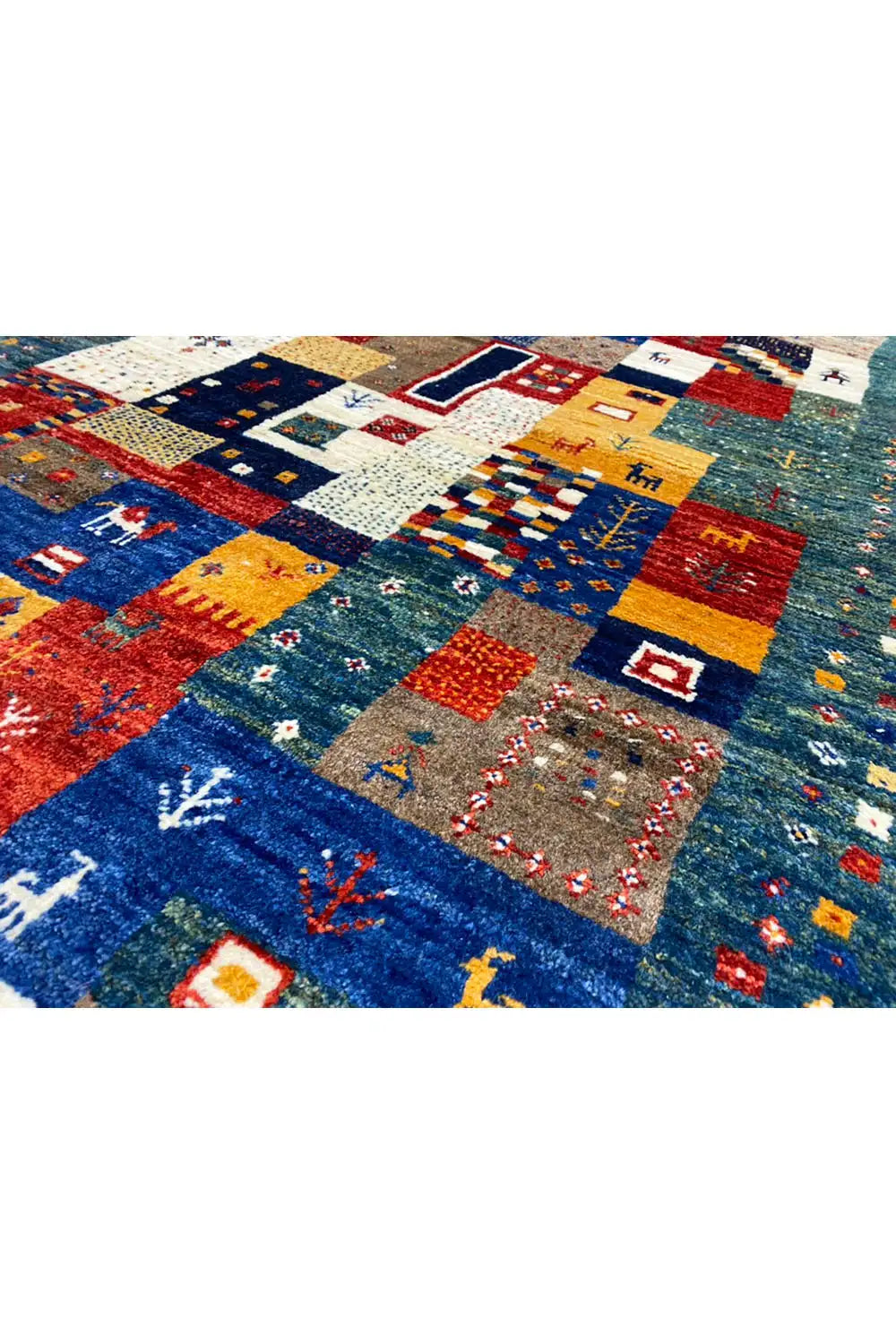 Gabbeh rug (127x79 cm) close-up with patchwork figure and plant motifs