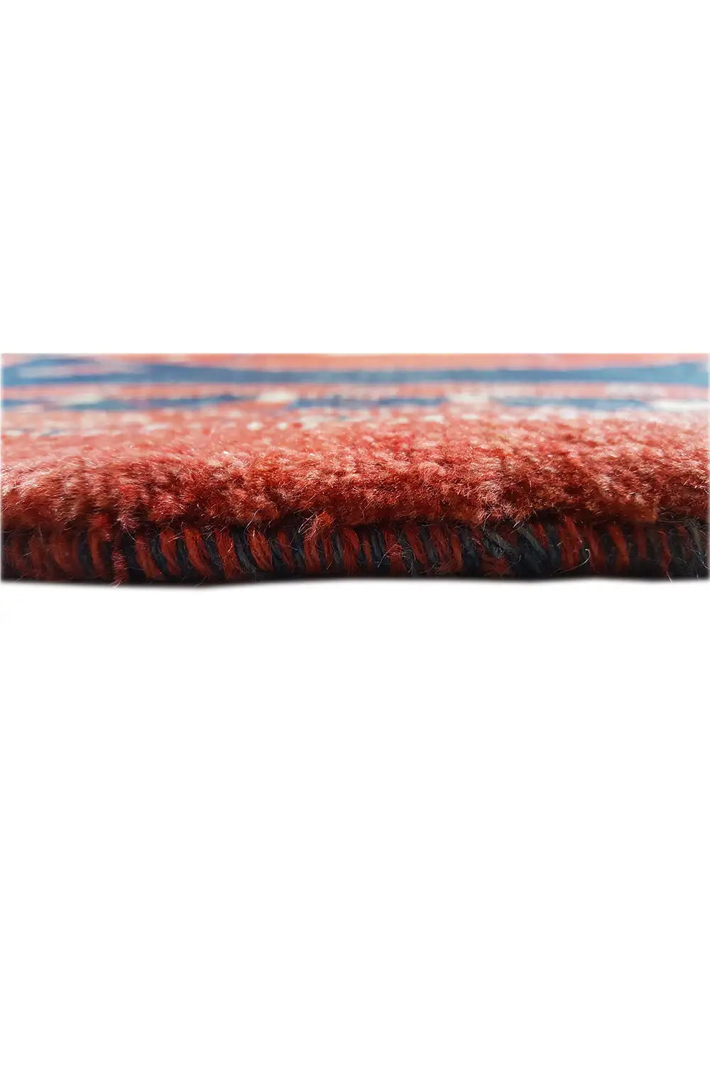 Carpet detail: fluffy red pile and dense edge finish