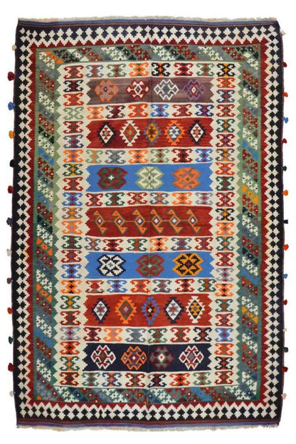 Qashqai rug, centered colorful grid of patterns with a dark-bordered edge