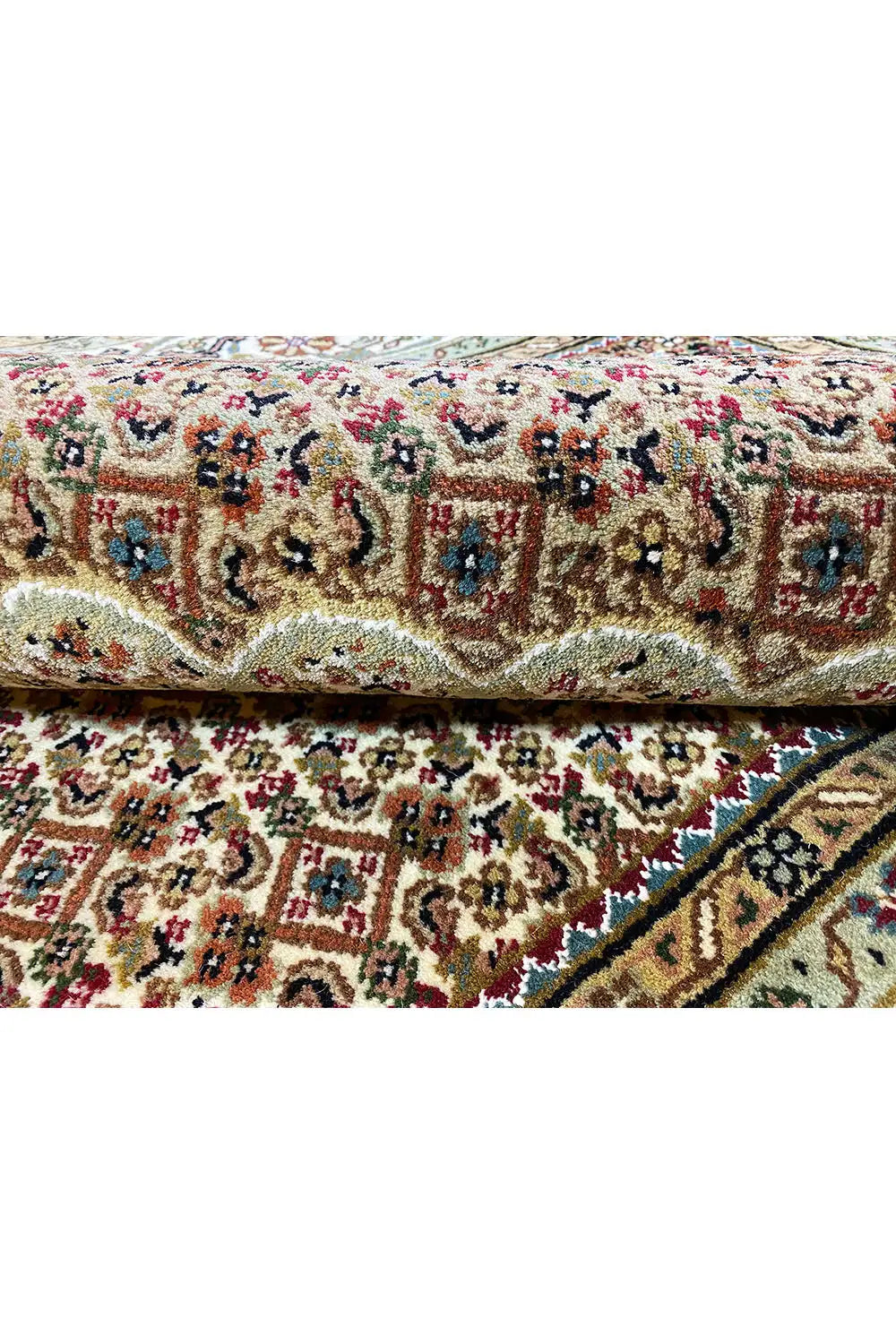 Indo Tabriz rug with twisted pile, cream-colored background, and colorful medallions
