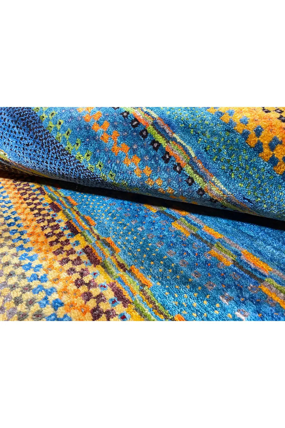 Close-up view of the carpet surface with a dense woven structure and colorful specks.