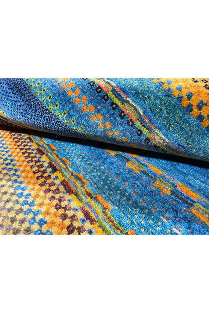 Close-up view of the carpet surface with a dense woven structure and colorful specks.