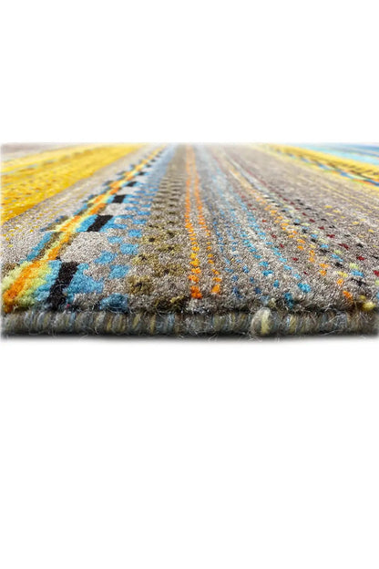 Gabbeh rug with dense fringe along the edge, stripes in blue and yellow.