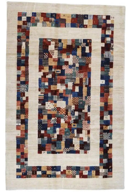Gabbeh rug with a central medallion of patchwork diamonds, blue/red on beige