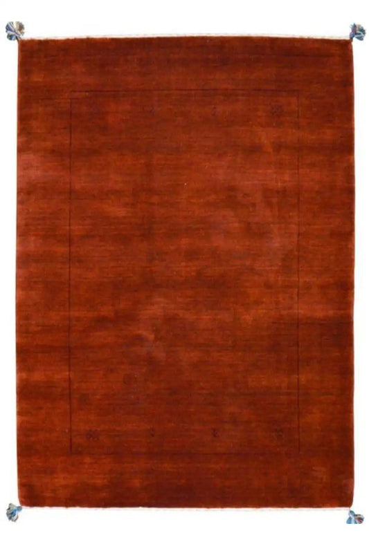Rectangular Gabbeh rug, solid reddish-brown, with corner knots and a border