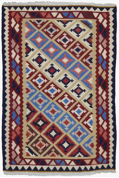 Kilim rug with a rectangular patterned field: multicolored diamonds, dark blue border and fringes