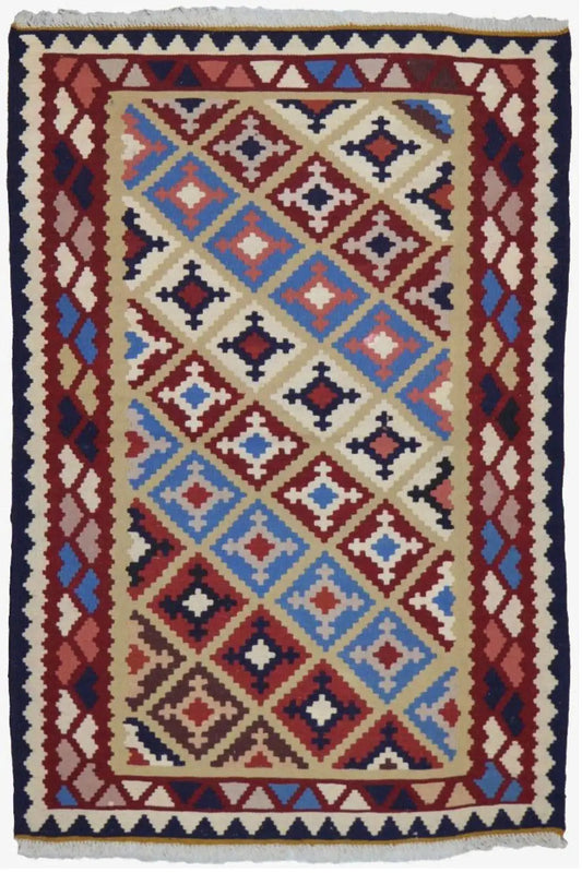 Kilim rug with a rectangular patterned field: multicolored diamonds, dark blue border and fringes