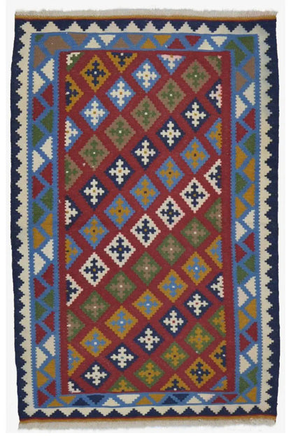 Colorful kilim rug with a large diamond pattern and multicolored border in blue and red