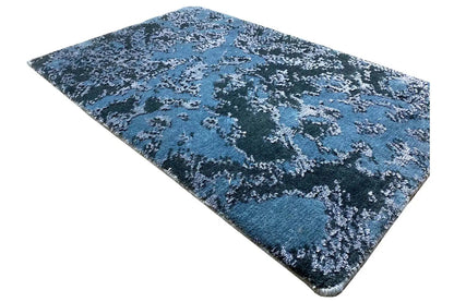 Designer rug 60x40 cm, blue pile pattern with dark spots, rectangular view