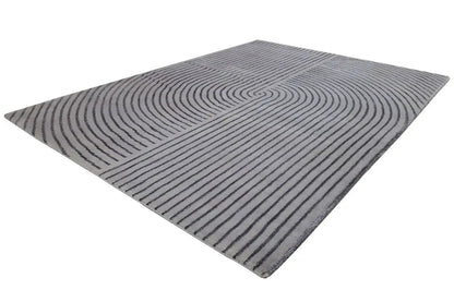 Square rug with a gray background and dark blue, curved line motifs