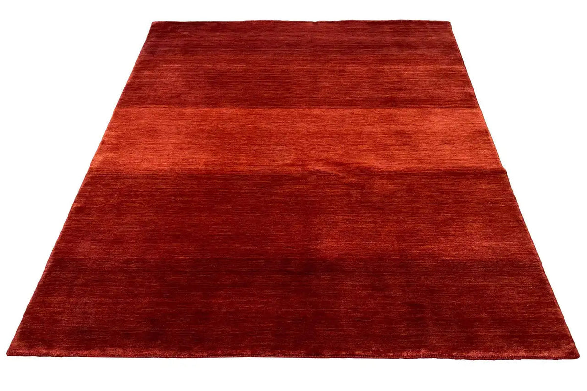 Gabbeh rug in reddish brown, rectangular shape, even woven texture