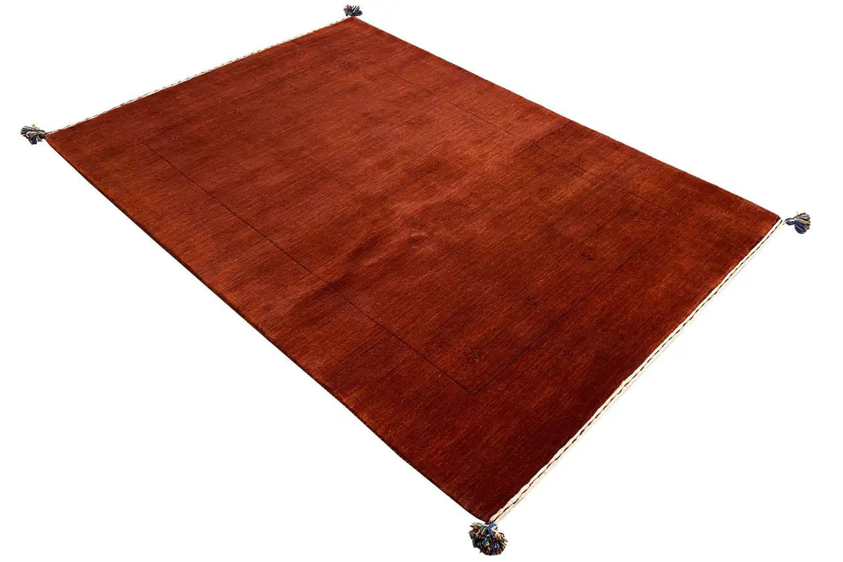 Gabbeh rug in a reddish-brown tone, rectangular, knots at the corners