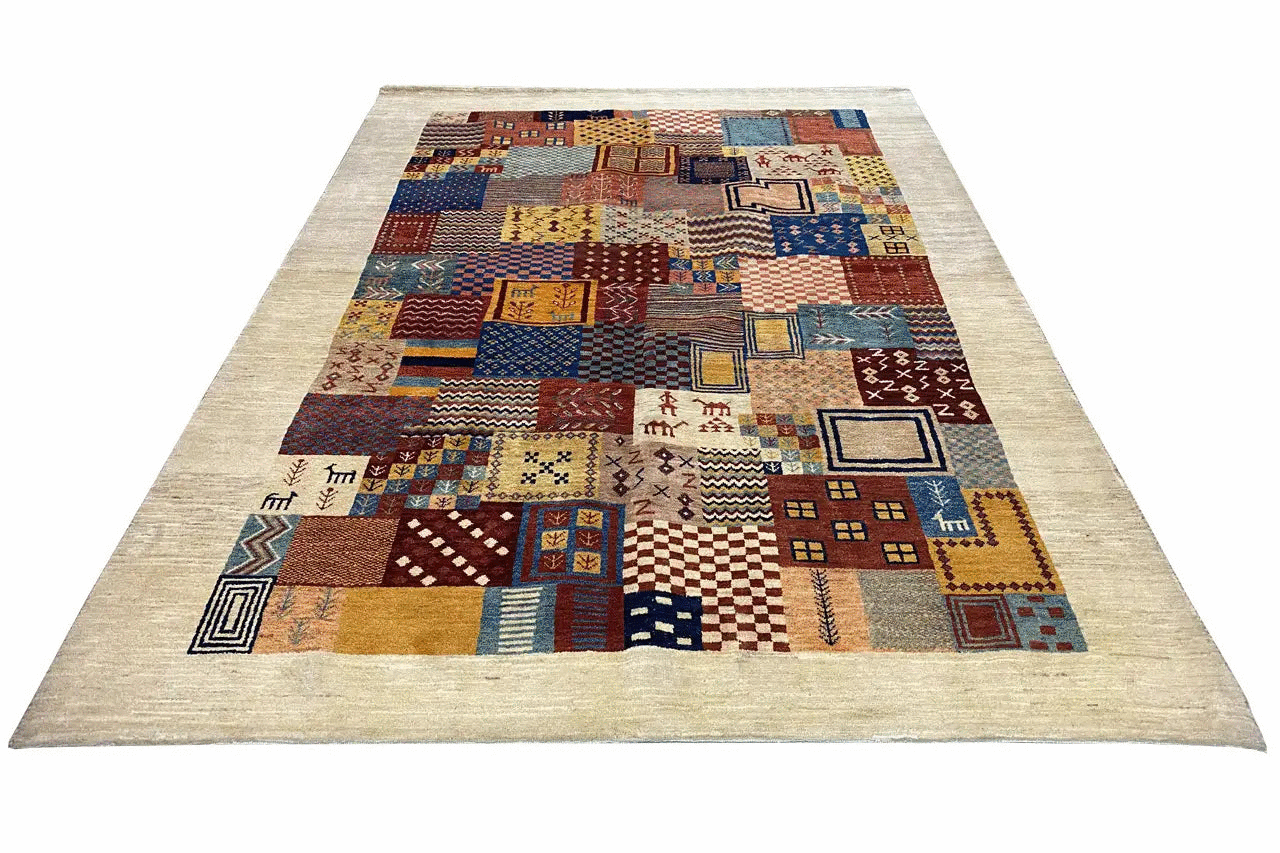 Rectangular Gabbeh rug “Lori” with a patchwork pattern in blue, brown, and beige