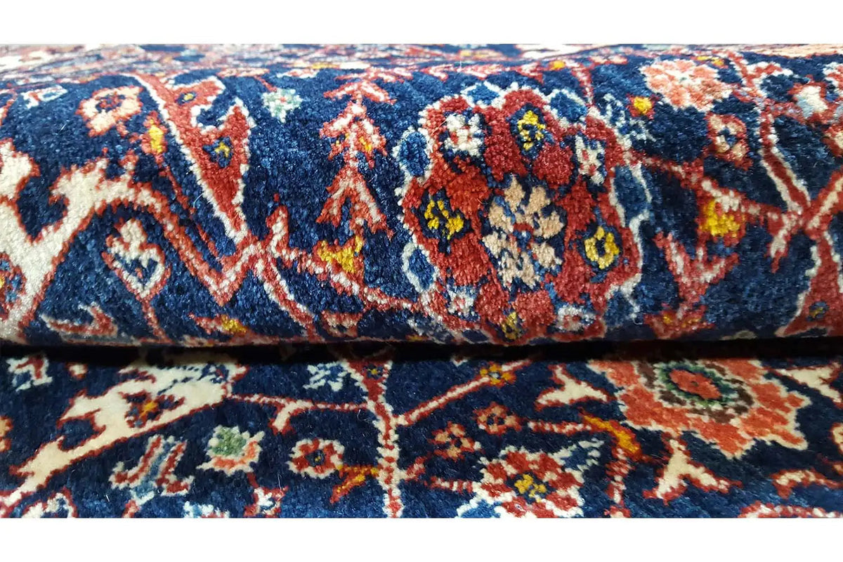 Detail of the Qashqai Exklusiv oriental rug: blue pattern with colorful ornaments