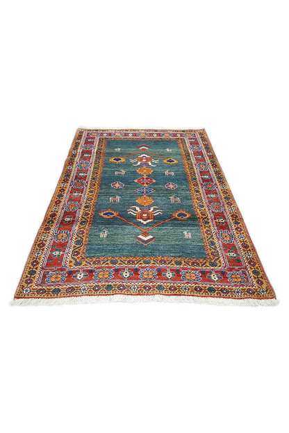 Gabbeh rug 162x110 cm in petrol green with a red border pattern and fringes