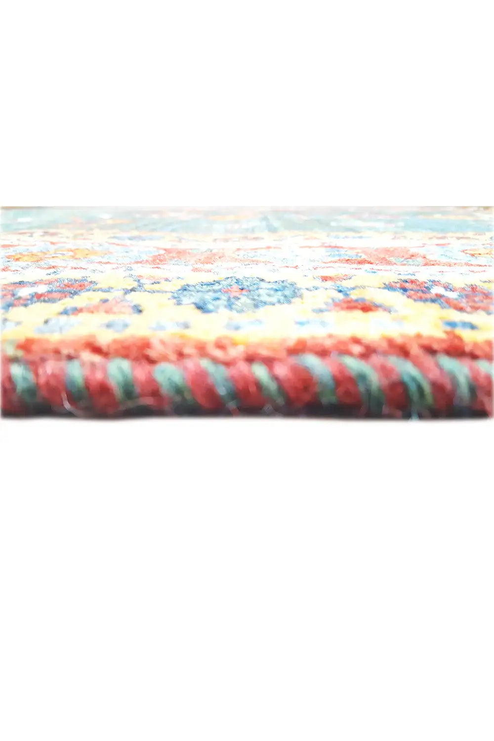 Rug edge with a multicolored border and fringes in petrol and red