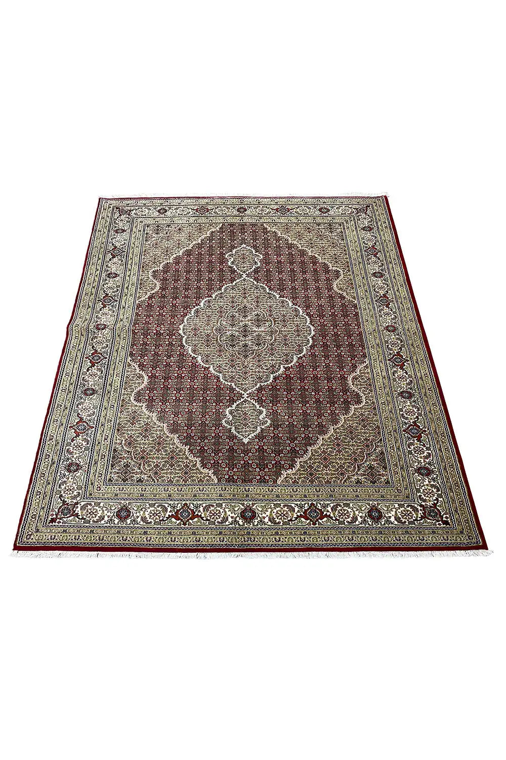 Tabriz carpet, viewed from above: central beige-red medallion with a colorful border