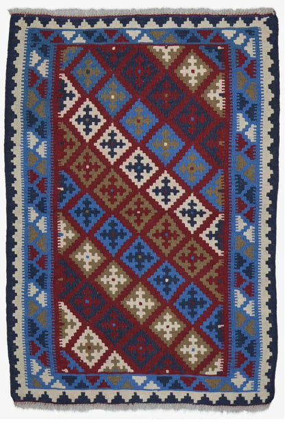 Kilim rug with a symmetrical diamond design in red, blue, beige, and cream
