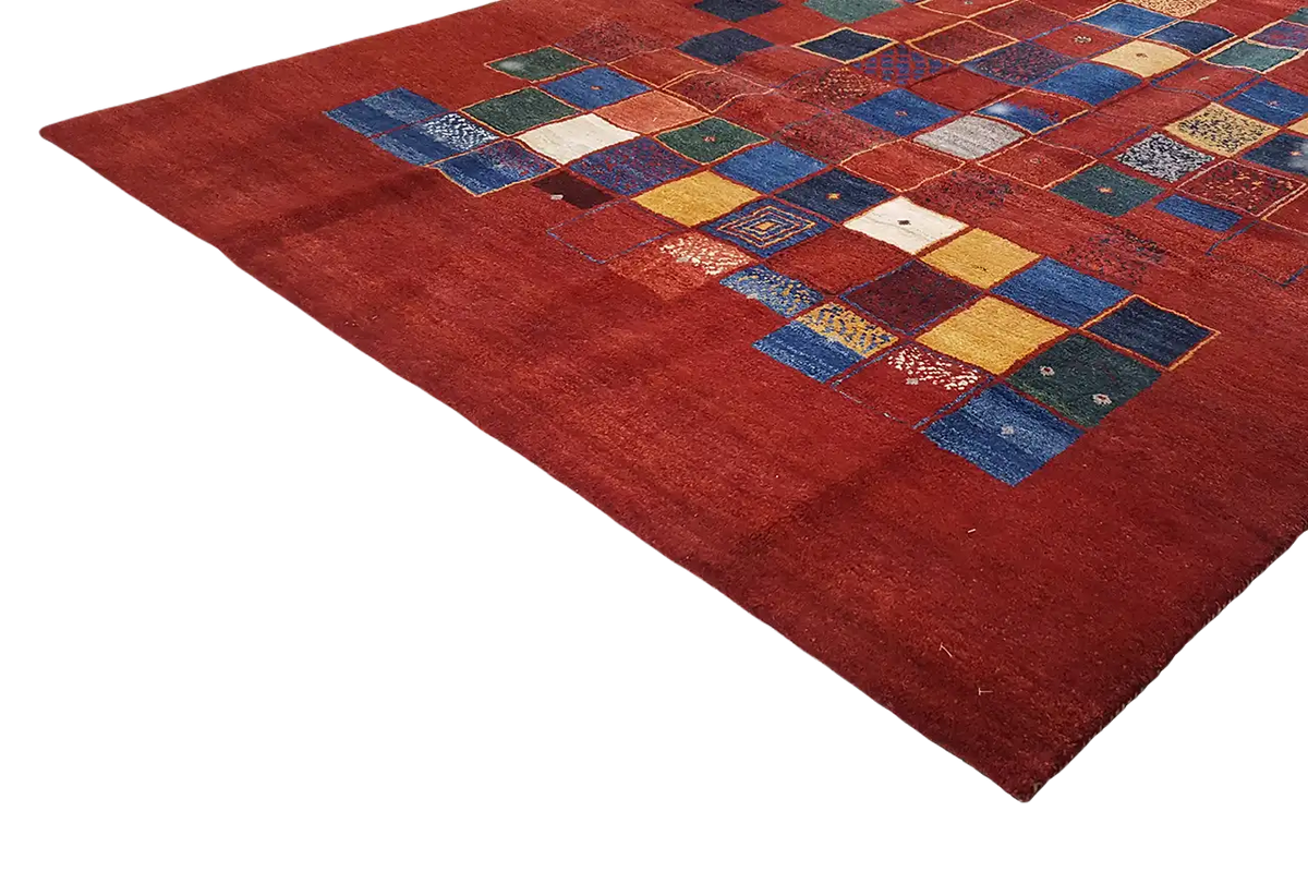 Gabbeh rug: red background with geometric patchwork of tiles
